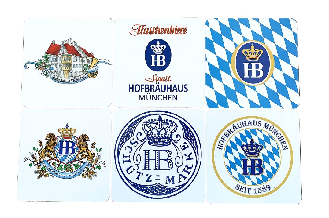 Sechs Bierdeckel-Untersetzer vom Hofbräuhaus München mit verschiedenen traditionellen Motiven: Wappen, Logos, historische Gebäude und bayerische Rauten in Blau-Weiß